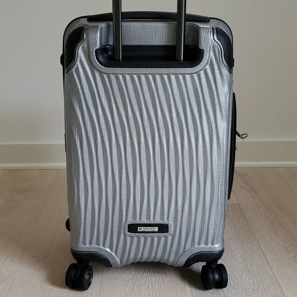 NWOT Tumi Latitude International Carry-On Spinner Luggage in Silver